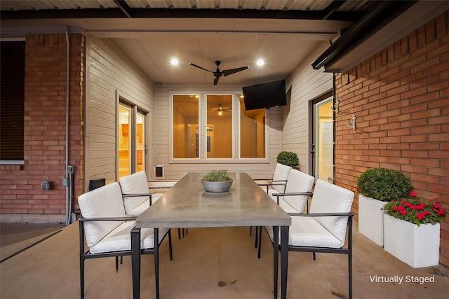 view of patio featuring outdoor dining area and ceiling fan