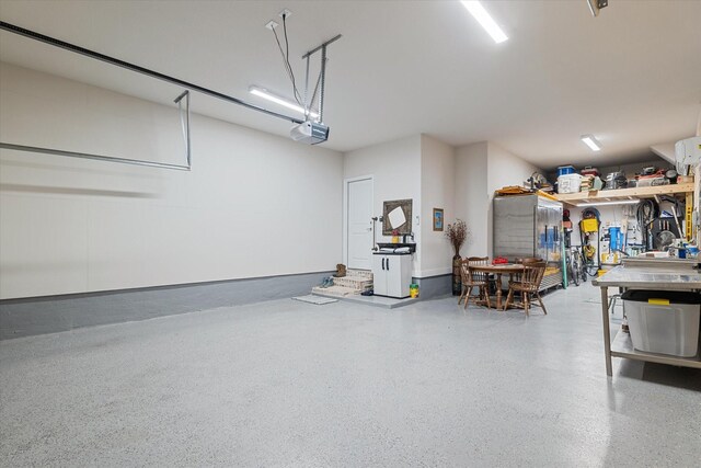 113 Glenwood Dr, Oak Point, TX 75068 - garage featuring a garage door opener