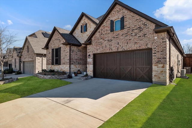 113 Glenwood Dr, Oak Point, TX 75068 - french country inspired facade with stone siding, a front lawn, concrete driveway, and brick siding