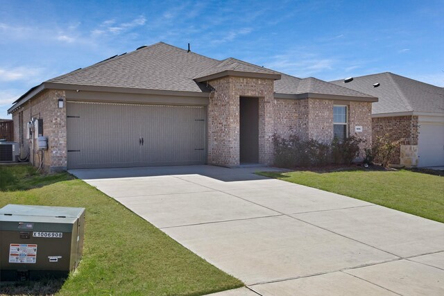 808 Glover Dr, Aubrey, TX 76227 - ranch-style house with a front yard, brick siding, a shingled roof, an attached garage, and driveway
