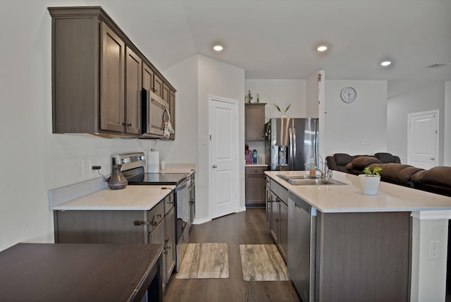 808 Glover Dr, Aubrey, TX 76227 - kitchen with appliances with stainless steel finishes, a sink, an island with sink, open floor plan, and dark wood-type flooring