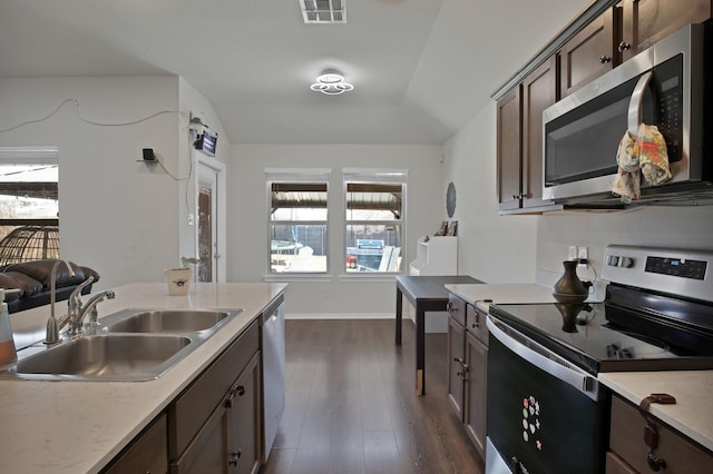 808 Glover Dr, Aubrey, TX 76227 - kitchen featuring visible vents, light countertops, a sink, dark wood finished floors, and appliances with stainless steel finishes