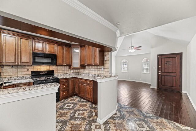 4512 Fletcher Ave, Fort Worth, TX 76107 - kitchen featuring lofted ceiling, ceiling fan, decorative backsplash, black appliances, and dark wood-type flooring