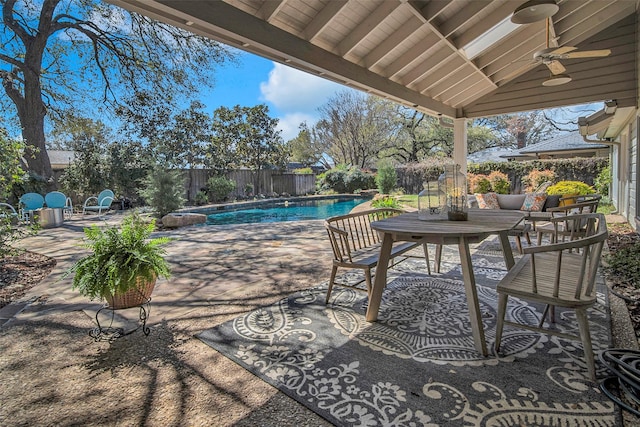9702 Trail Hill Dr, Dallas, TX 75238 - view of patio / terrace with a fenced in pool, a ceiling fan, outdoor dining area, and a fenced backyard