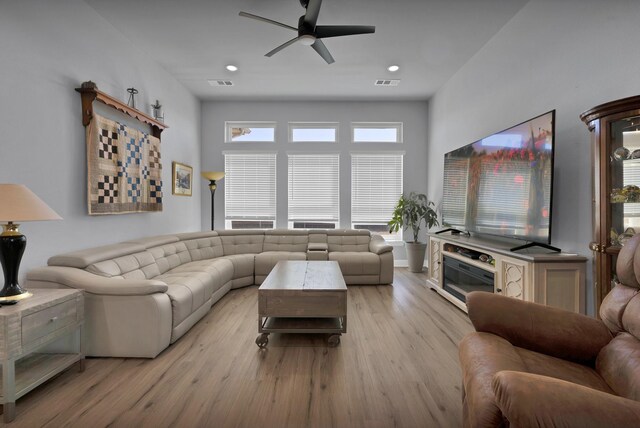 living area featuring ceiling fan, recessed lighting, visible vents, and light wood-style floors
