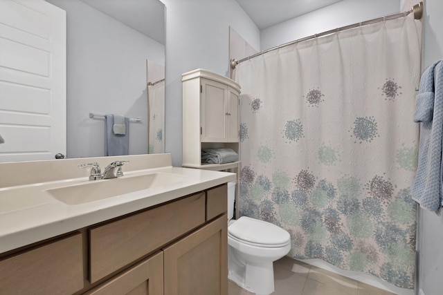 full bath featuring tile patterned floors, toilet, and vanity