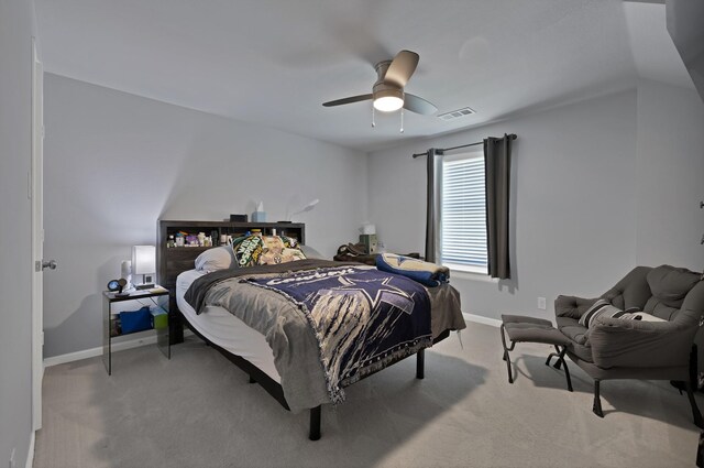 bedroom with visible vents, a ceiling fan, light carpet, and baseboards