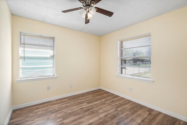 7918 Racine Dr, Dallas, TX 75232 - empty room featuring baseboards, a textured ceiling, wood finished floors, and a ceiling fan