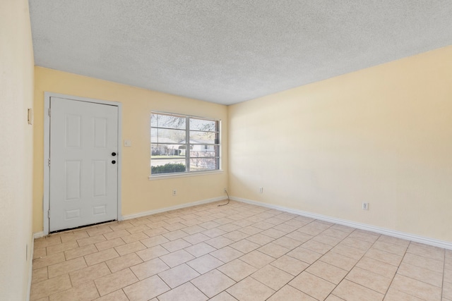 7918 Racine Dr, Dallas, TX 75232 - empty room featuring a textured ceiling and baseboards