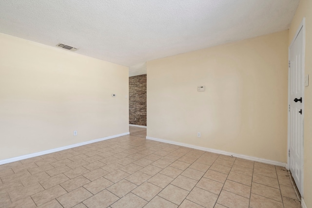 7918 Racine Dr, Dallas, TX 75232 - empty room with baseboards, visible vents, and a textured ceiling