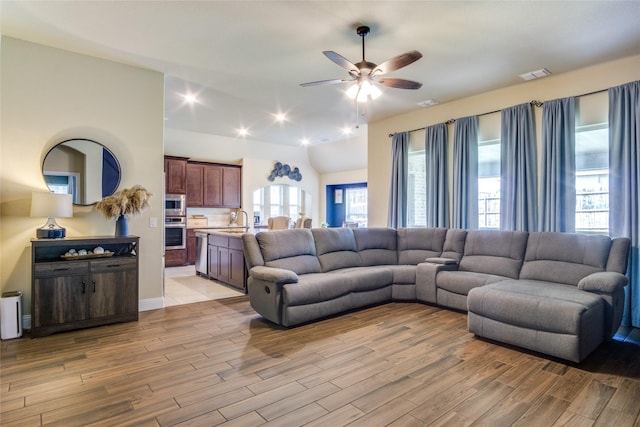 632 Ridgewater Trl, Fort Worth, TX 76131 - living area with lofted ceiling, light wood-type flooring, visible vents, and ceiling fan
