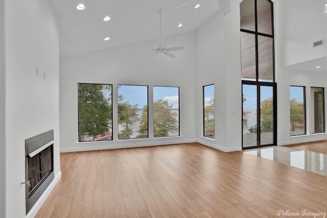 1756 Willow Point Dr, Shreveport, LA 71119 - unfurnished living room with high vaulted ceiling, a fireplace, recessed lighting, wood finished floors, and ceiling fan