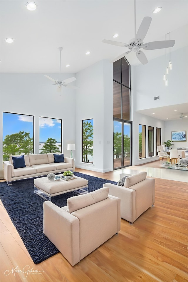 1756 Willow Point Dr, Shreveport, LA 71119 - living area featuring a towering ceiling, ceiling fan, wood finished floors, and recessed lighting