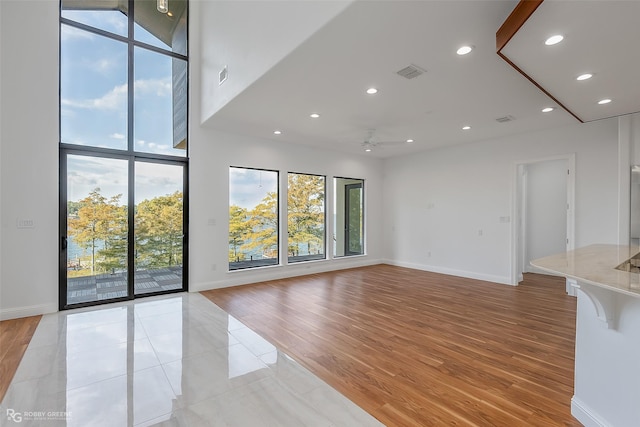 1756 Willow Point Dr, Shreveport, LA 71119 - empty room featuring plenty of natural light, a ceiling fan, light wood-type flooring, and recessed lighting