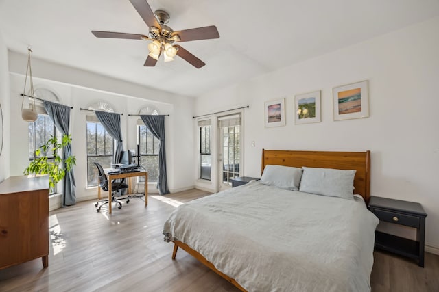 3105 San Jacinto St Unit 304, Dallas, TX 75204 - bedroom featuring an office area, access to outside, wood finished floors, and french doors