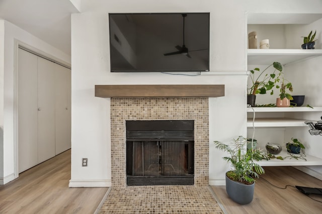 3105 San Jacinto St Unit 304, Dallas, TX 75204 - detailed view of wood finished floors and a tile fireplace