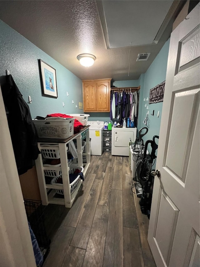 112 Robert Cir, Red Oak, TX 75154 - laundry area with visible vents, attic access, washer and dryer, dark wood-style floors, and cabinet space