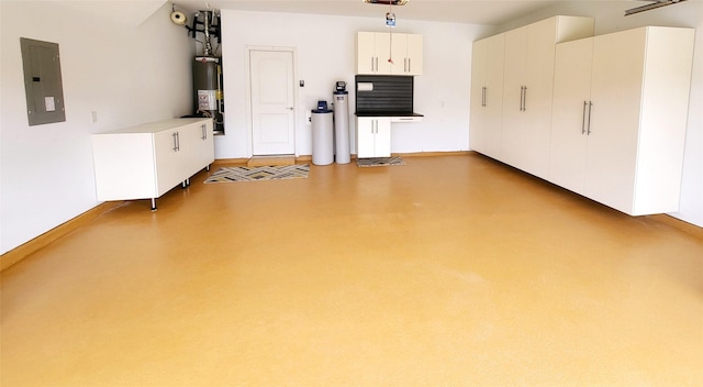262 Jones St, Irving, TX 75063 - garage featuring electric panel, gas water heater, and baseboards