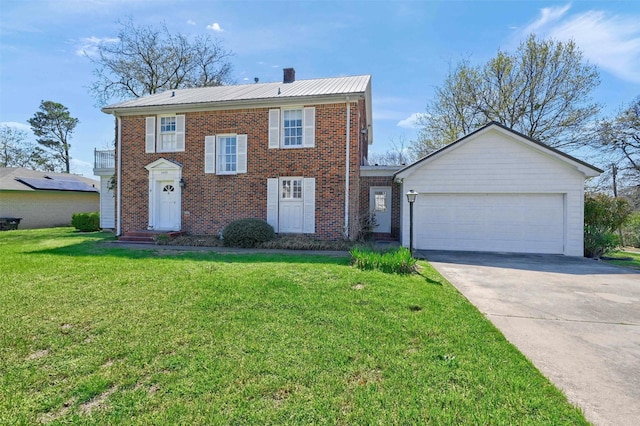 1430 W Woodard St, Denison, TX 75020 - view of front of home featuring a front yard, driveway, a garage, brick siding, and metal roof