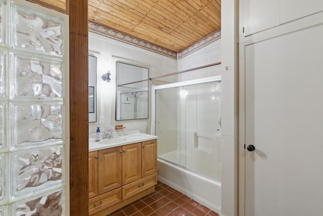 full bath featuring wood ceiling, ornamental molding, tile patterned floors, combined bath / shower with glass door, and vanity