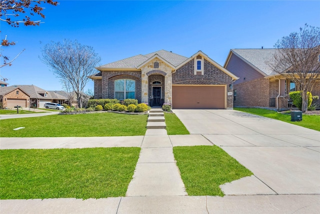 108 Oakmont Dr, Argyle, TX 76226 - french country home with stone siding, concrete driveway, an attached garage, a front yard, and brick siding
