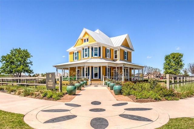 108 Oakmont Dr, Argyle, TX 76226 - farmhouse inspired home with a porch, metal roof, and fence