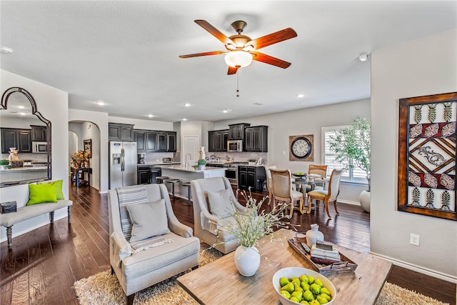 108 Oakmont Dr, Argyle, TX 76226 - living area with baseboards, ceiling fan, recessed lighting, arched walkways, and dark wood-style floors