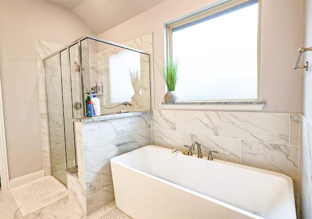 209 Chesapeake Dr, Forney, TX 75126 - full bath featuring a freestanding bath, marble finish floors, a stall shower, tile walls, and lofted ceiling