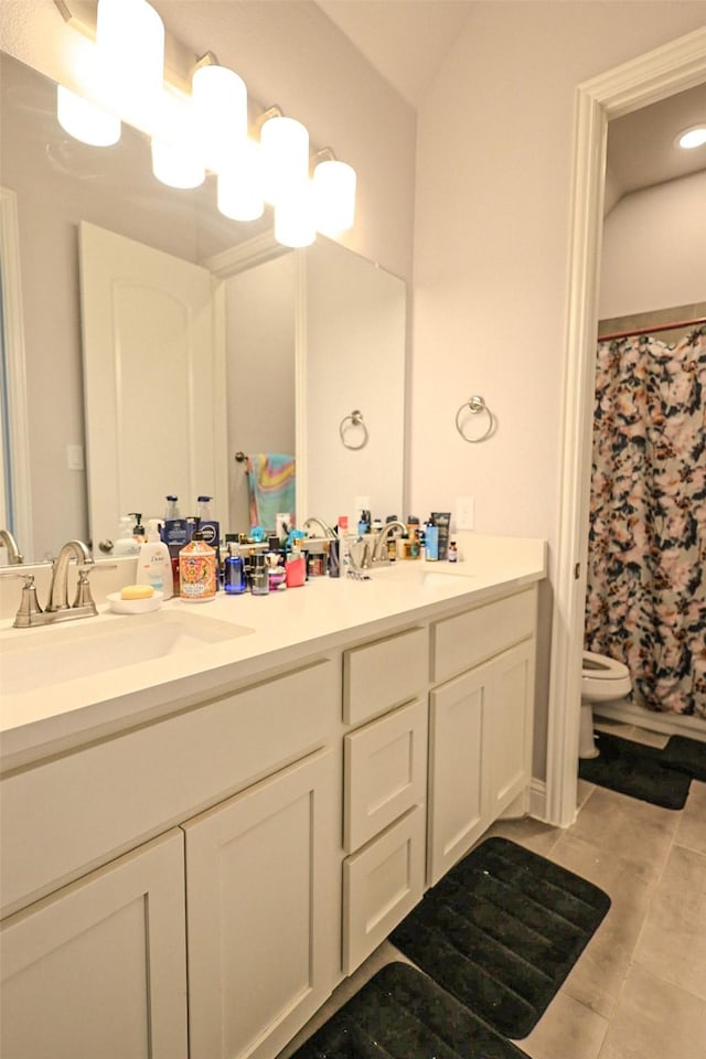 209 Chesapeake Dr, Forney, TX 75126 - full bath with double vanity, toilet, tile patterned floors, and curtained shower