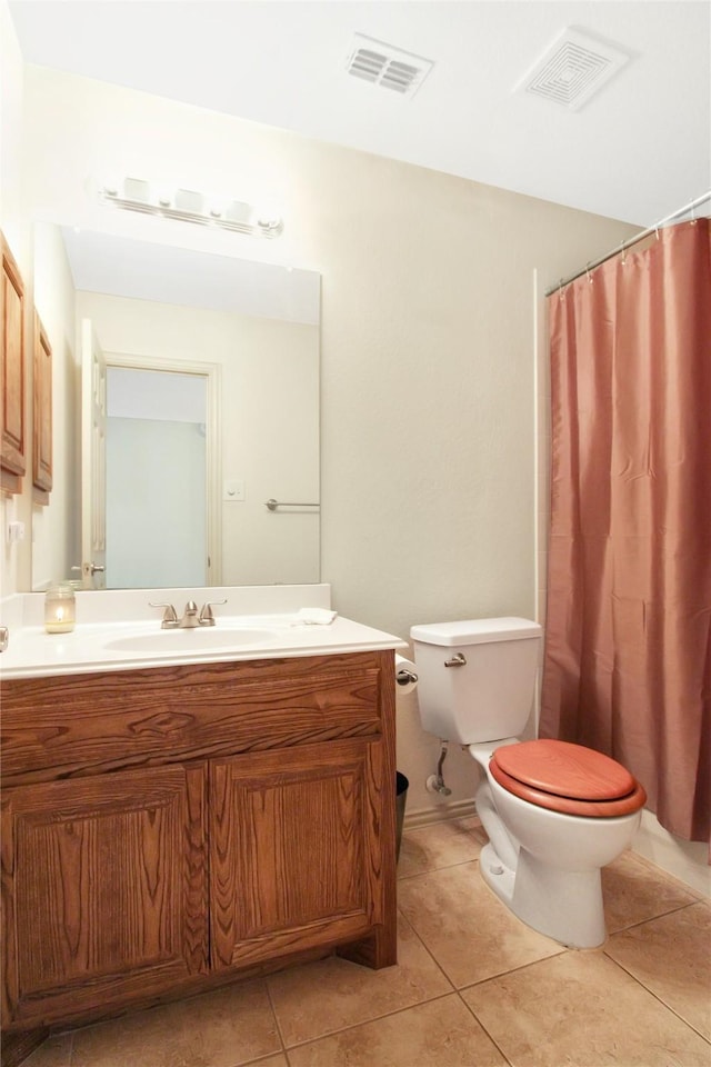 full bathroom featuring vanity, toilet, tile patterned flooring, and visible vents