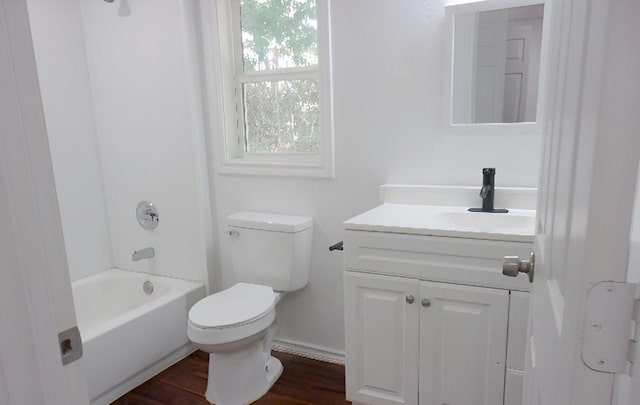 711 Dubois St, Denison, TX 75020 - full bathroom with toilet, shower / washtub combination, wood finished floors, and vanity