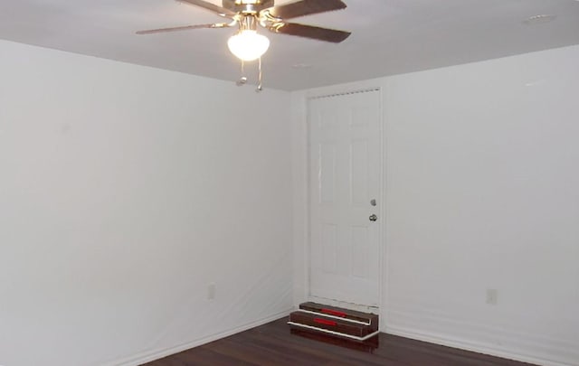 711 Dubois St, Denison, TX 75020 - spare room with baseboards, a ceiling fan, and wood finished floors