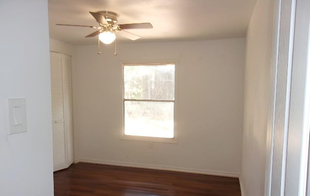 711 Dubois St, Denison, TX 75020 - unfurnished room with dark wood-style floors, baseboards, and ceiling fan