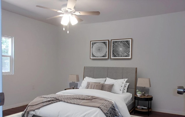 711 Dubois St, Denison, TX 75020 - bedroom with wood finished floors, baseboards, and ceiling fan