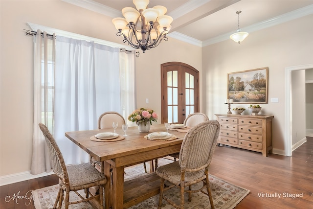 dining area featuring wood finished floors, french doors, arched walkways, a chandelier, and ornamental molding