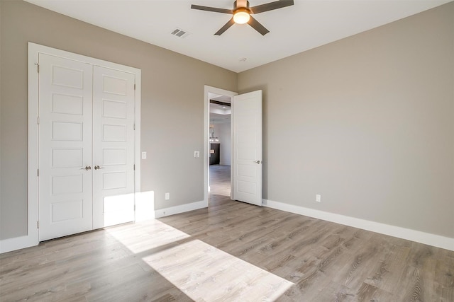 224 Ash Creek Dr W, Azle, TX 76020 - unfurnished bedroom featuring baseboards, visible vents, a closet, and light wood-type flooring