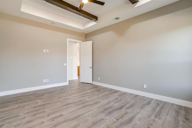 224 Ash Creek Dr W, Azle, TX 76020 - spare room with visible vents, light wood-style flooring, beamed ceiling, baseboards, and ceiling fan