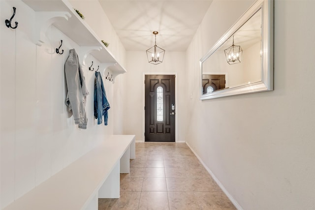 2224 Loreto Dr, Fort Worth, TX 76177 - mudroom with light tile patterned floors, baseboards, and a notable chandelier