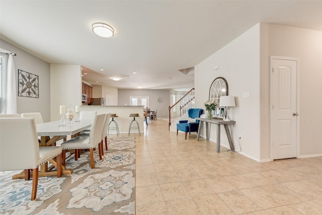 2224 Loreto Dr, Fort Worth, TX 76177 - dining space featuring stairway, light tile patterned flooring, and recessed lighting