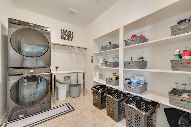 2224 Loreto Dr, Fort Worth, TX 76177 - laundry room featuring stacked washer / dryer and tile patterned flooring