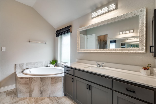 9600 Blue Stem Ln, Little Elm, TX 75068 - bathroom featuring vanity, a garden tub, lofted ceiling, and a shower