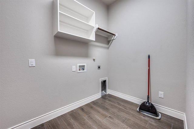 9600 Blue Stem Ln, Little Elm, TX 75068 - washroom featuring hookup for a gas dryer, hookup for an electric dryer, dark wood finished floors, washer hookup, and baseboards