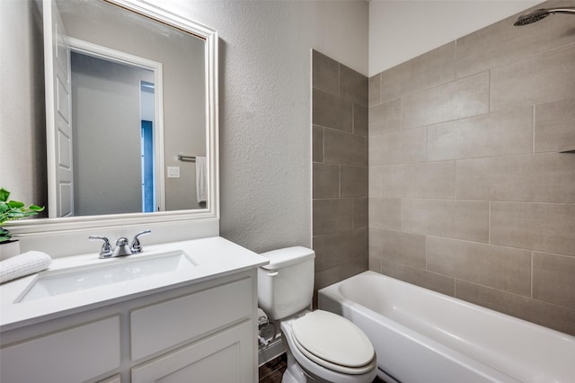 9600 Blue Stem Ln, Little Elm, TX 75068 - bathroom featuring toilet, vanity, a textured wall, and  shower combination