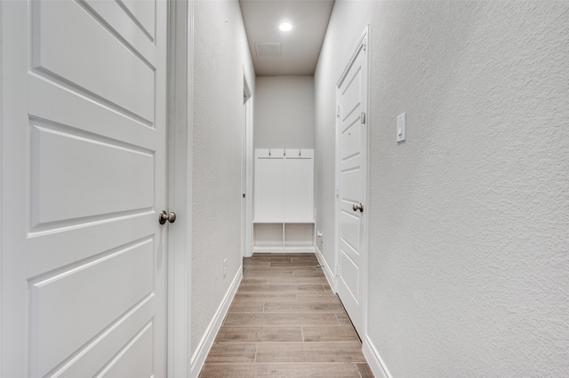 9600 Blue Stem Ln, Little Elm, TX 75068 - corridor with a textured wall, wood finished floors, and baseboards