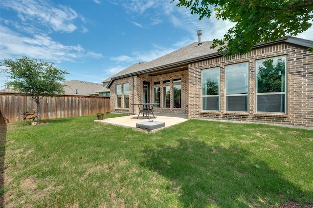 9600 Blue Stem Ln, Little Elm, TX 75068 - rear view of property with brick siding and a patio