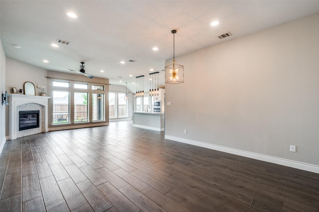 9600 Blue Stem Ln, Little Elm, TX 75068 - unfurnished living room with baseboards, a ceiling fan, dark wood-type flooring, and recessed lighting