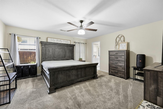 bedroom featuring visible vents, ceiling fan, light carpet, and baseboards