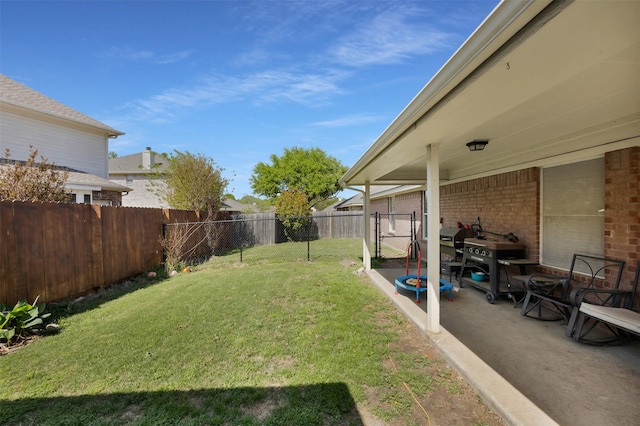 view of yard with a patio and a fenced backyard
