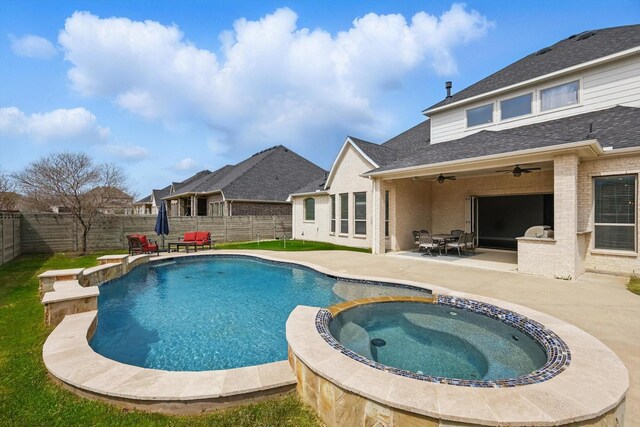 view of pool with a ceiling fan, a fenced backyard, a patio area, and a pool with connected hot tub