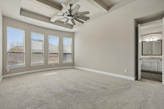 carpeted spare room featuring ceiling fan, coffered ceiling, baseboards, and beamed ceiling